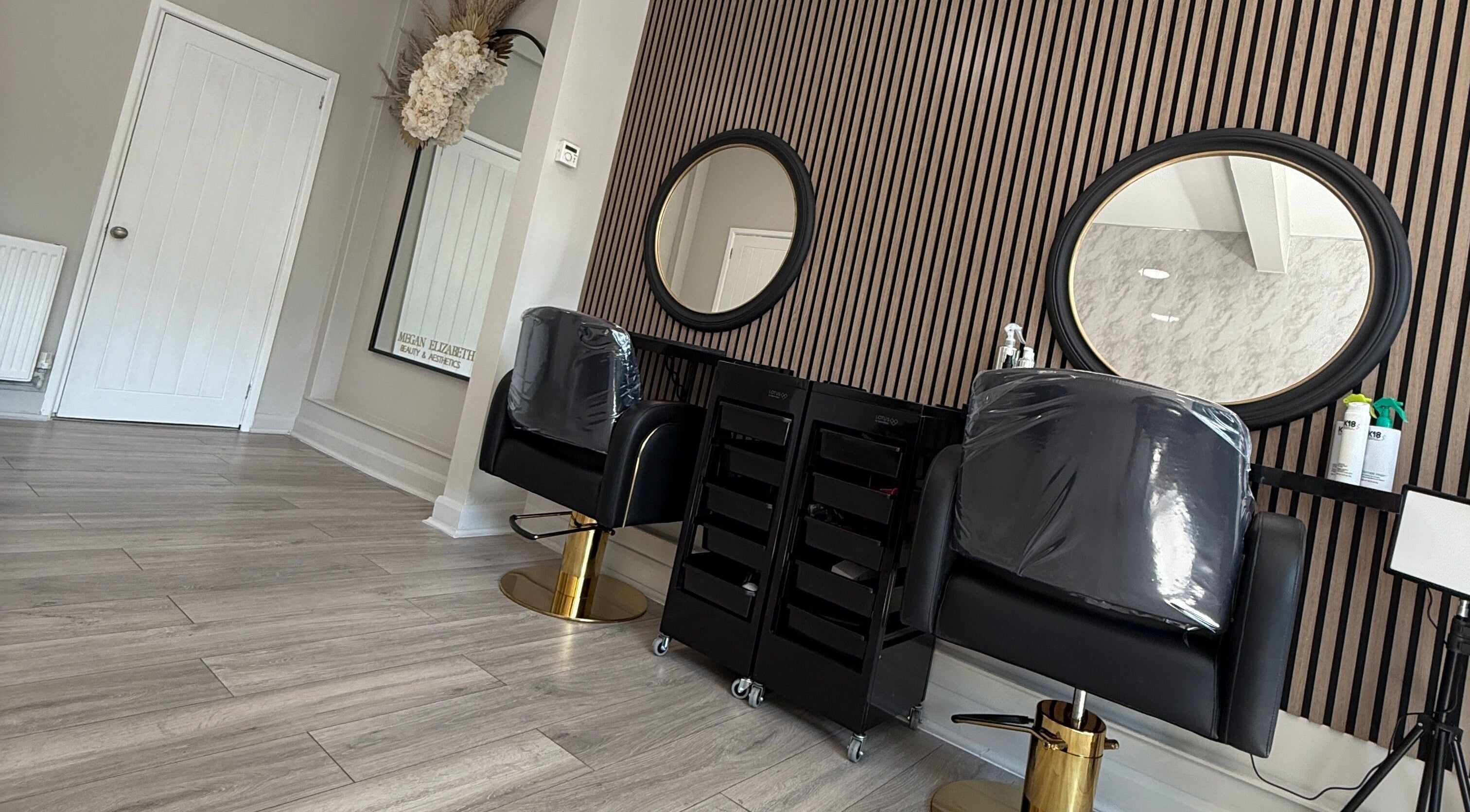 Chic salon interior with stylish chairs at Katie Louise Hair in Birmingham, England, GB.