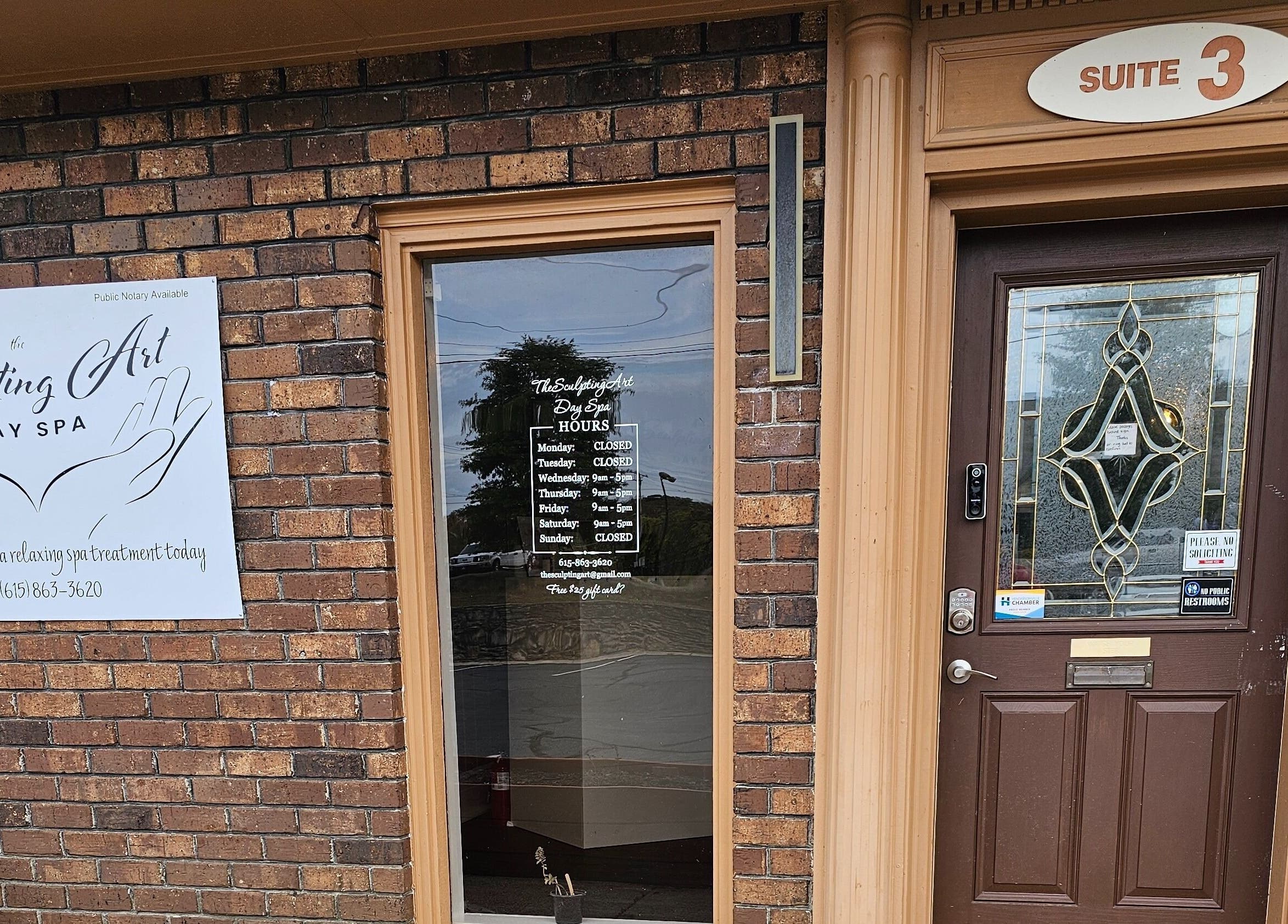 Entrance of The Sculpting Art Day Spa in Hendersonville, TN, US, showcasing signage and ornate door design.