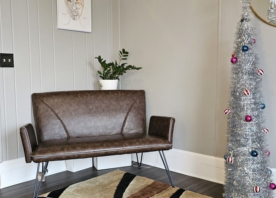 Stylish seating area with holiday decor at The Sculpting Art Day Spa, Hendersonville, TN, US.