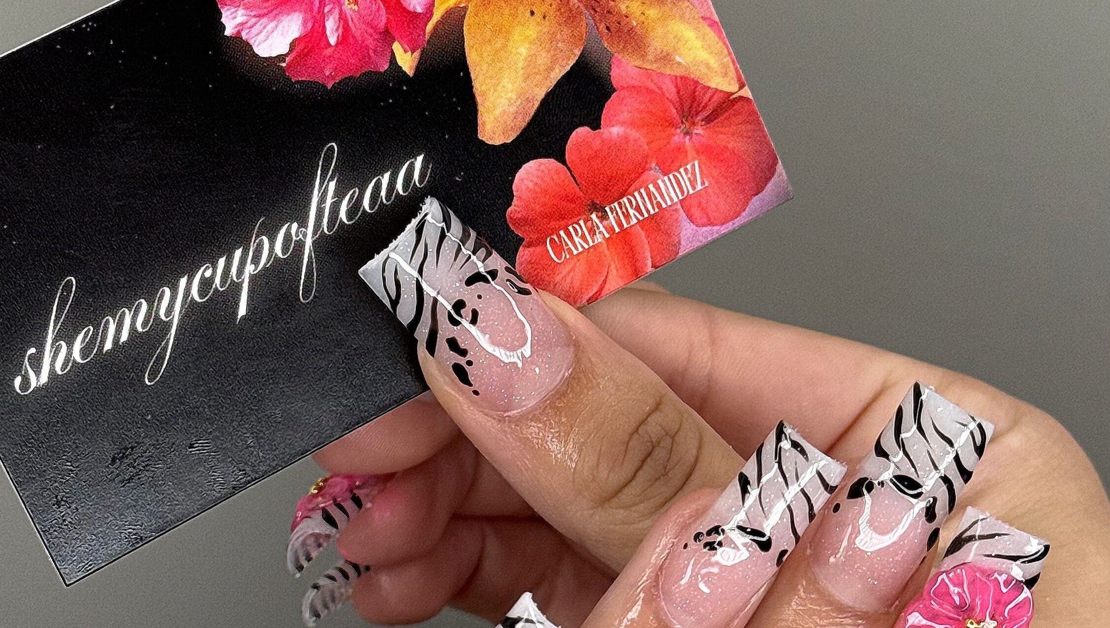 Elegant floral nail art at SHEMYCUPOFTEAA in Round Lake, Illinois, US showcasing unique zebra and flower design.