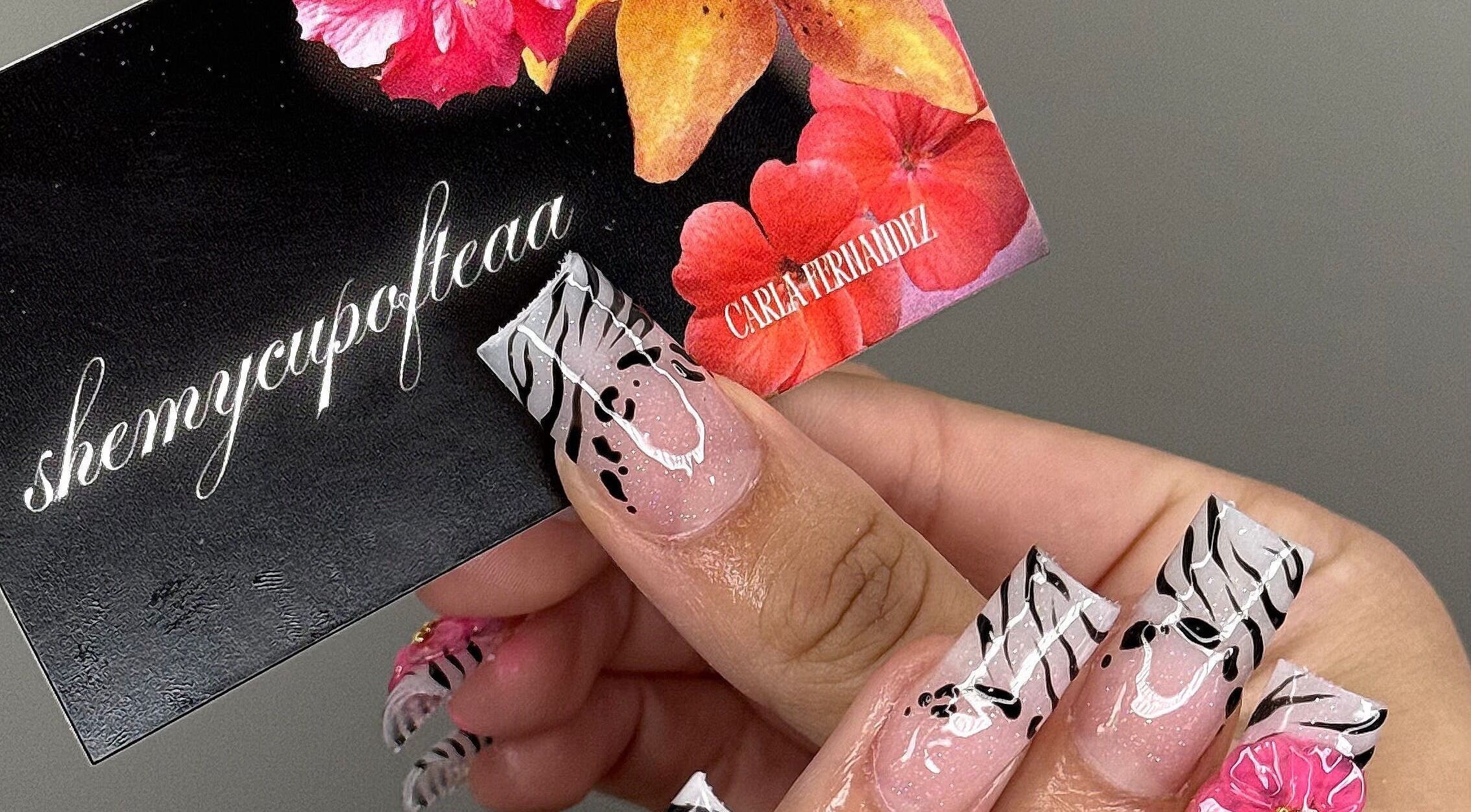 Elegant floral nail art at SHEMYCUPOFTEAA in Round Lake, Illinois, US showcasing unique zebra and flower design.