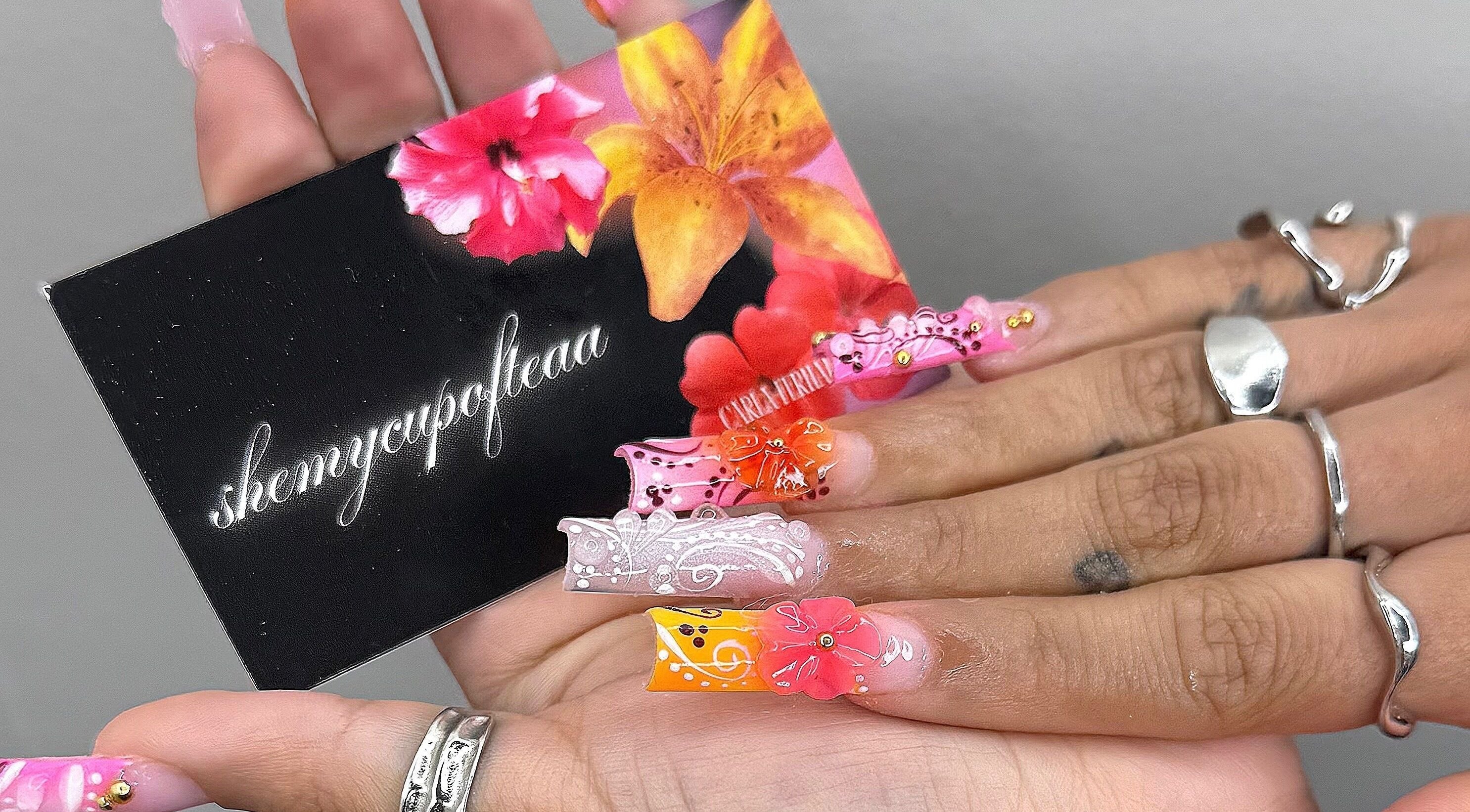 Vibrant floral nail art by SHEMYCUPOFTEAA, located in Round Lake, Illinois, US. Colorful and intricate design.