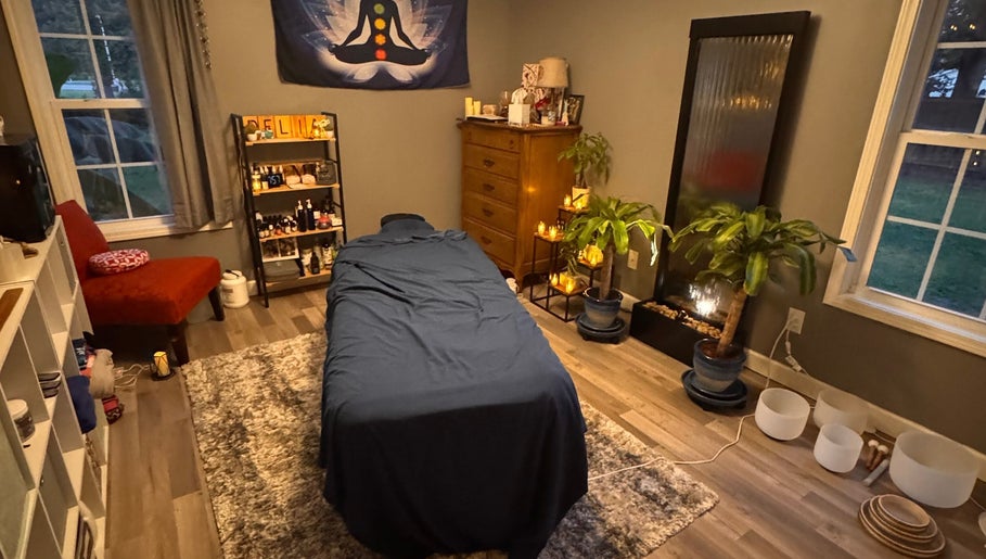 Comfortable massage room at Falling Waters Massage in Rocky Point, North Carolina, US with calming decor.