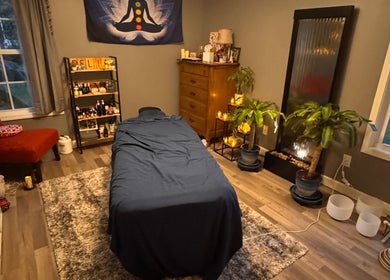 Comfortable massage room at Falling Waters Massage in Rocky Point, North Carolina, US with calming decor.