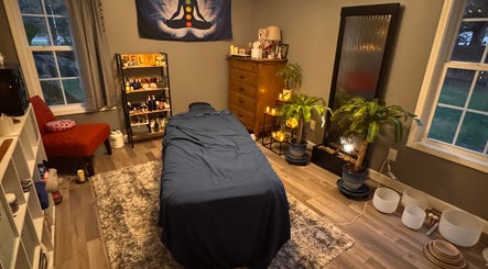 Comfortable massage room at Falling Waters Massage in Rocky Point, North Carolina, US with calming decor.