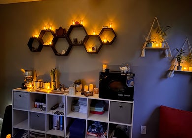 Cozy ambiance at Falling Waters Massage, Rocky Point, North Carolina, US with warm candle lighting and elegant decor.