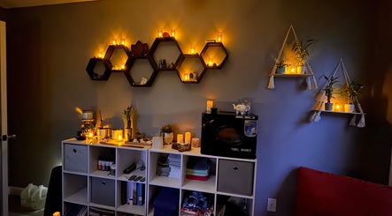 Cozy ambiance at Falling Waters Massage, Rocky Point, North Carolina, US with warm candle lighting and elegant decor.