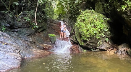 Couple enjoying serene waterfall at 4K Adventures and Tours, Diego Martin, Diego Martin Regional Corporation, TT.