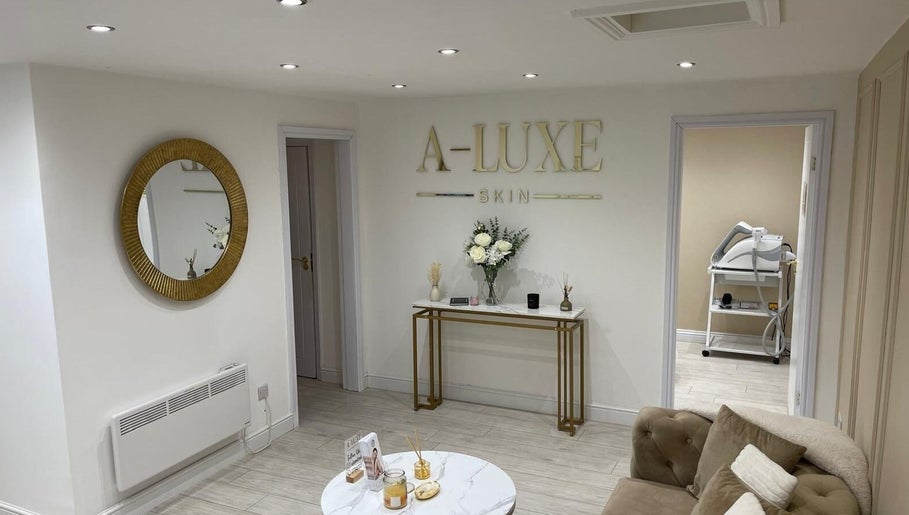 Elegant lounge at A-Luxe Skin, Birmingham, England, GB with chic decor and plush seating.