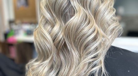 Elegant blonde waves styled at EmmaJane Hairdressing, Alexandria, Scotland, GB.