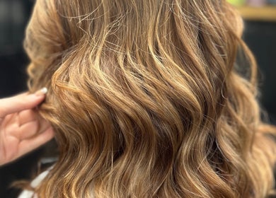 Soft, golden waves styled at EmmaJane Hairdressing, Alexandria, Scotland, GB. A luxurious salon experience.