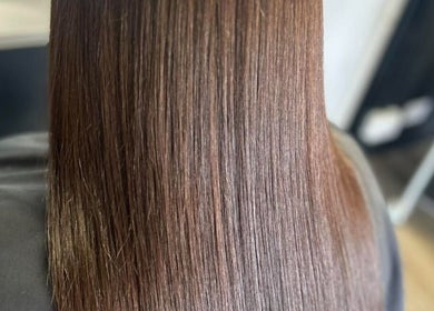 Smooth, shiny brown hair at EmmaJane Hairdressing, Alexandria, Scotland, GB, showcasing professional styling.