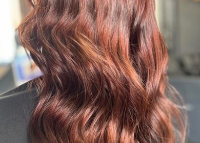 Rich brown wavy hair styled at EmmaJane Hairdressing, Alexandria, Scotland, GB, showcasing vibrant color.