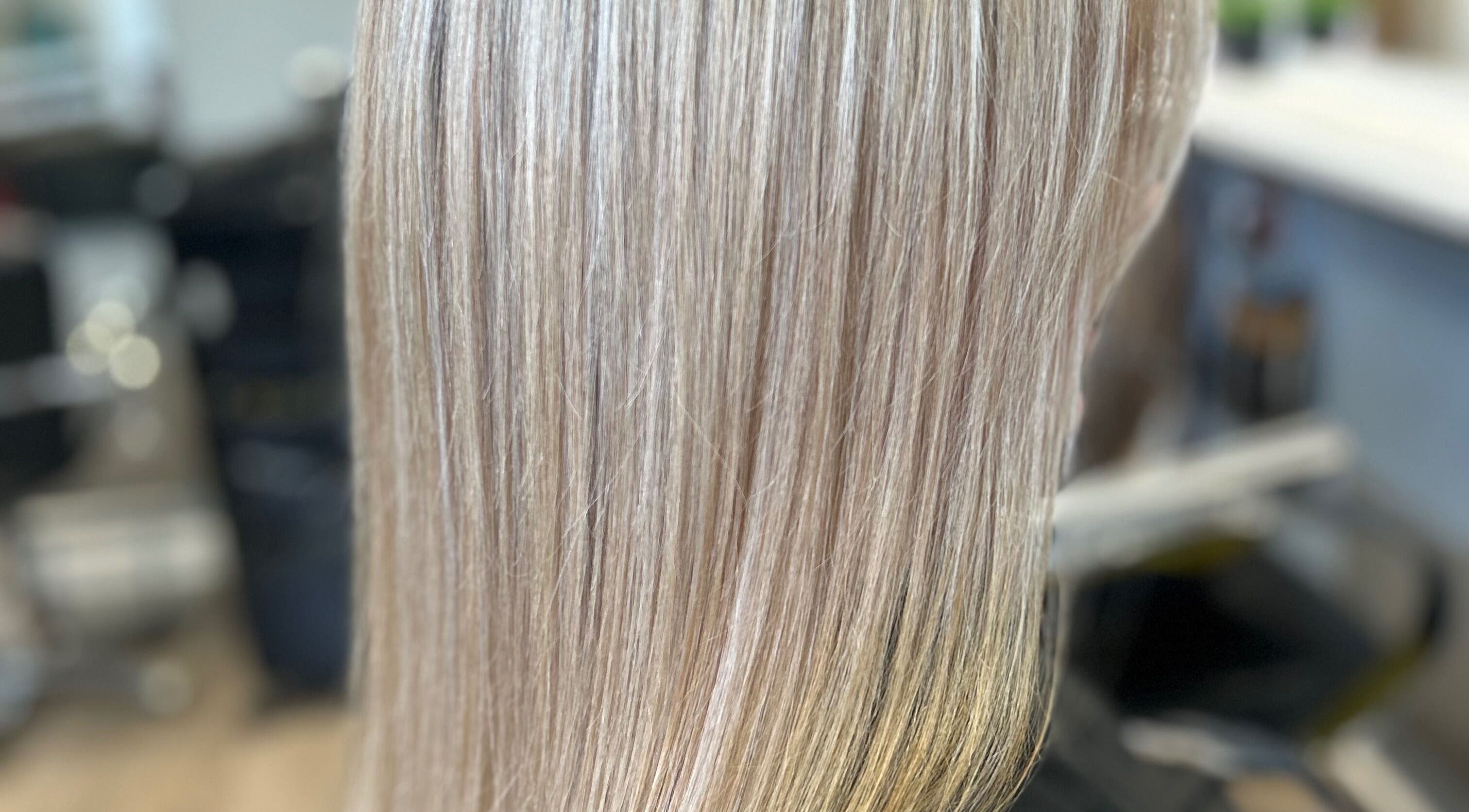 Blonde hair transformation at EmmaJane Hairdressing, Cardross, Scotland, GB showcasing sleek smooth finish.
