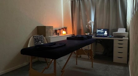 Peaceful massage room at Pain Therapy- massage, Houghton Regis, England, GB, with a cozy ambiance.