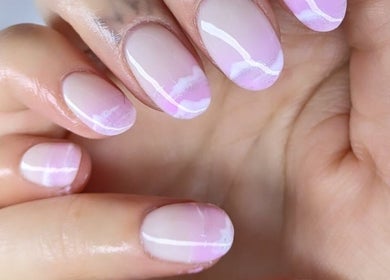Elegant pastel pink nails at THE DOLL HOUSE NAILS, Bristol, England, GB showcasing stylish manicure.