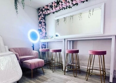 Chic interior of Facecard_ap in Purley, England, GB, featuring pink decor and floral accents.