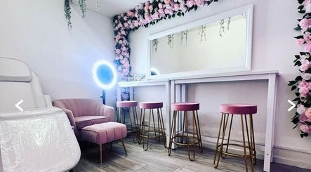 Chic interior of Facecard_ap in Purley, England, GB, featuring pink decor and floral accents.