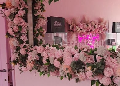 Elegant pink floral decor at Facecard_ap, Purley, England, GB enhancing beauty and wellness experience.