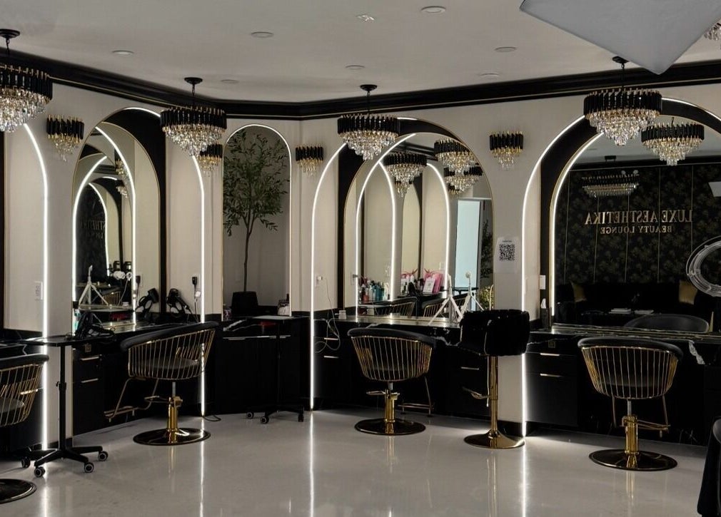 Luxurious interior of Armstyle beauty lounge in Glendale, California, US, featuring elegant chandeliers and mirrors.