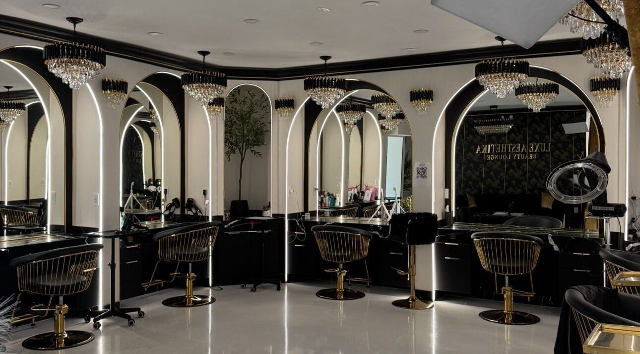 Luxurious interior of Armstyle beauty lounge in Glendale, California, US, featuring elegant chandeliers and mirrors.