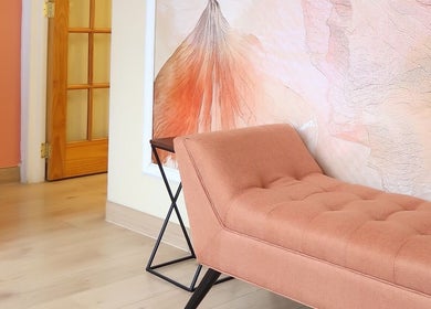 Stylish peach lounge chair at Sky Spa Laser, Forest Hills, New York, US, offering a tranquil waiting area.