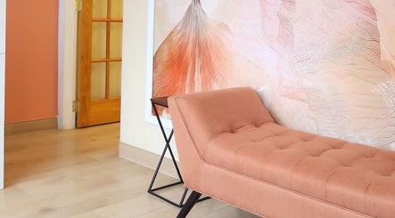 Elegant chaise lounge against abstract mural in Sky Spa Laser, Forest Hills, New York, US.