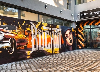 Graffiti vibrant la BUCATTI BARBERSHOP BY EL NINO, Popești-leordeni, Județul Ilfov, RO lângă intrare.