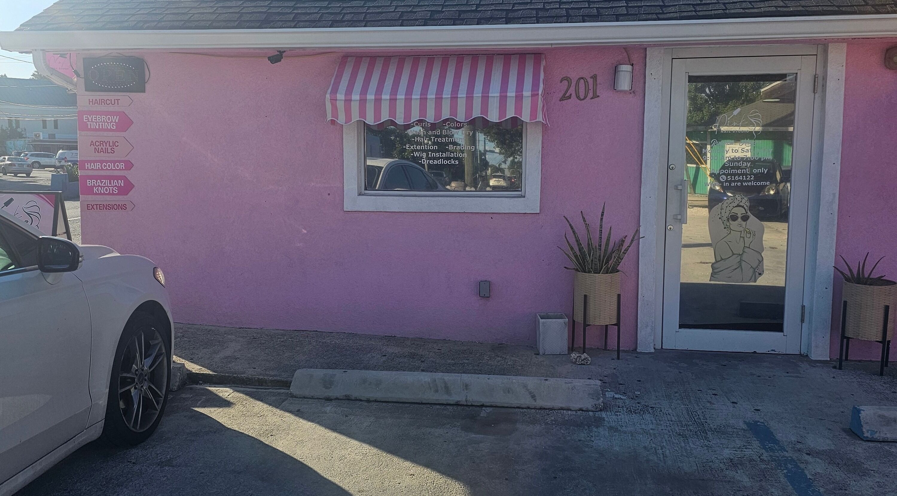 Front of Pink Nail Studio in George Town, KY with pink walls and signage.