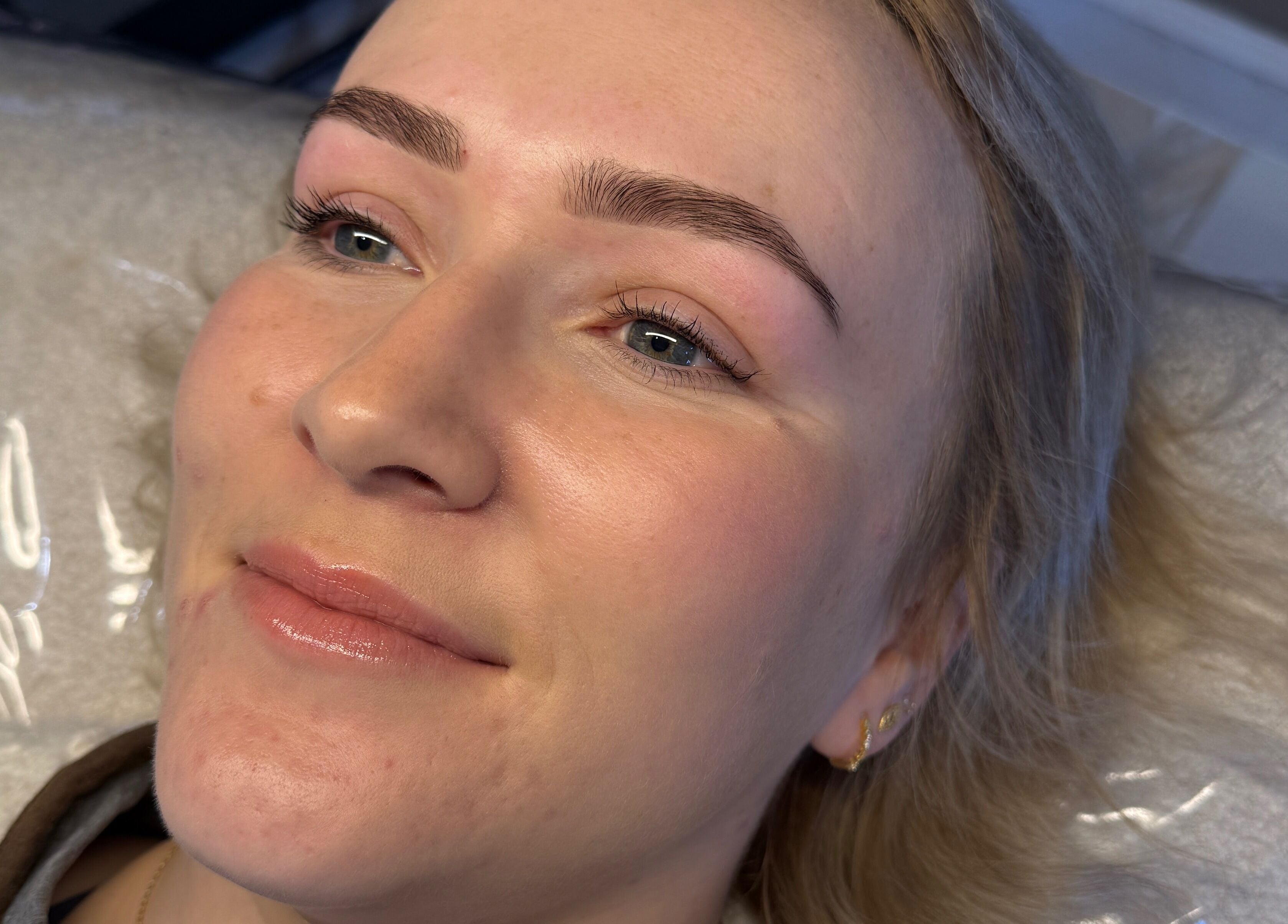 Client with glowing skin post-treatment at Chelsea Beauty Artistry, Prestatyn, Wales, GB.