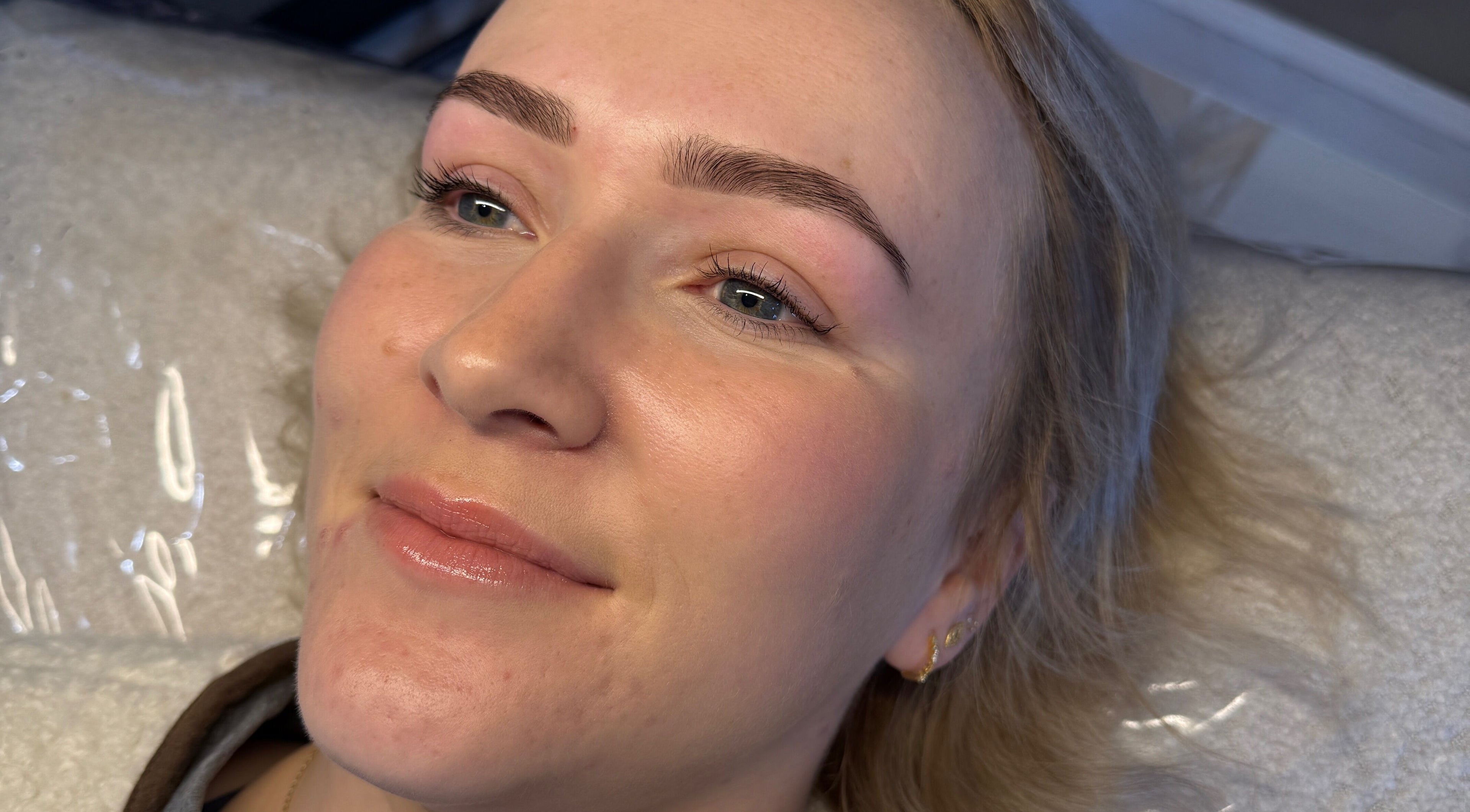 Client with glowing skin post-treatment at Chelsea Beauty Artistry, Prestatyn, Wales, GB.