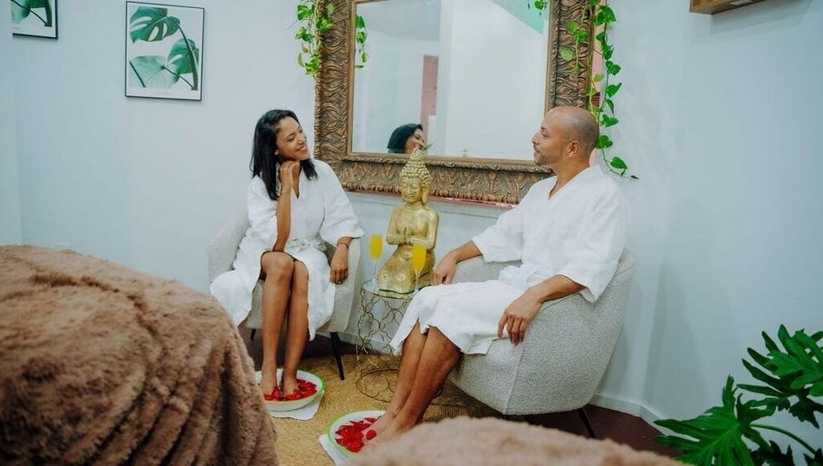 Couple enjoying foot spa at Massage Therapy Kundalini, Noord, US, in a serene setting.
