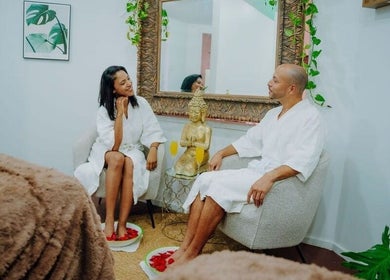 Couple enjoying foot spa at Massage Therapy Kundalini, Noord, US, in a serene setting.