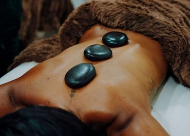 Hot stone massage therapy at Massage Therapy Kundalini, Noord, US. Relaxing wellness experience.