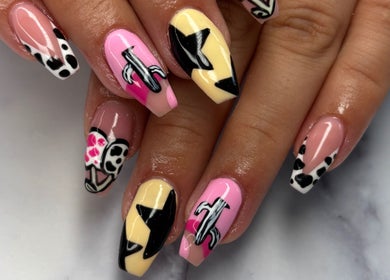 Creative nail art design at Nails By Maisie, South Woodham Ferrers, England, GB. Bold patterns and colors.