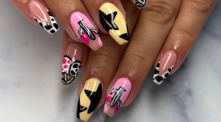 Creative nail art design at Nails By Maisie, South Woodham Ferrers, England, GB. Bold patterns and colors.