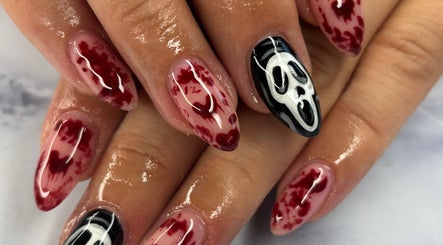 Unique red and black nail art at Nails By Maisie, South Woodham Ferrers, England, GB.