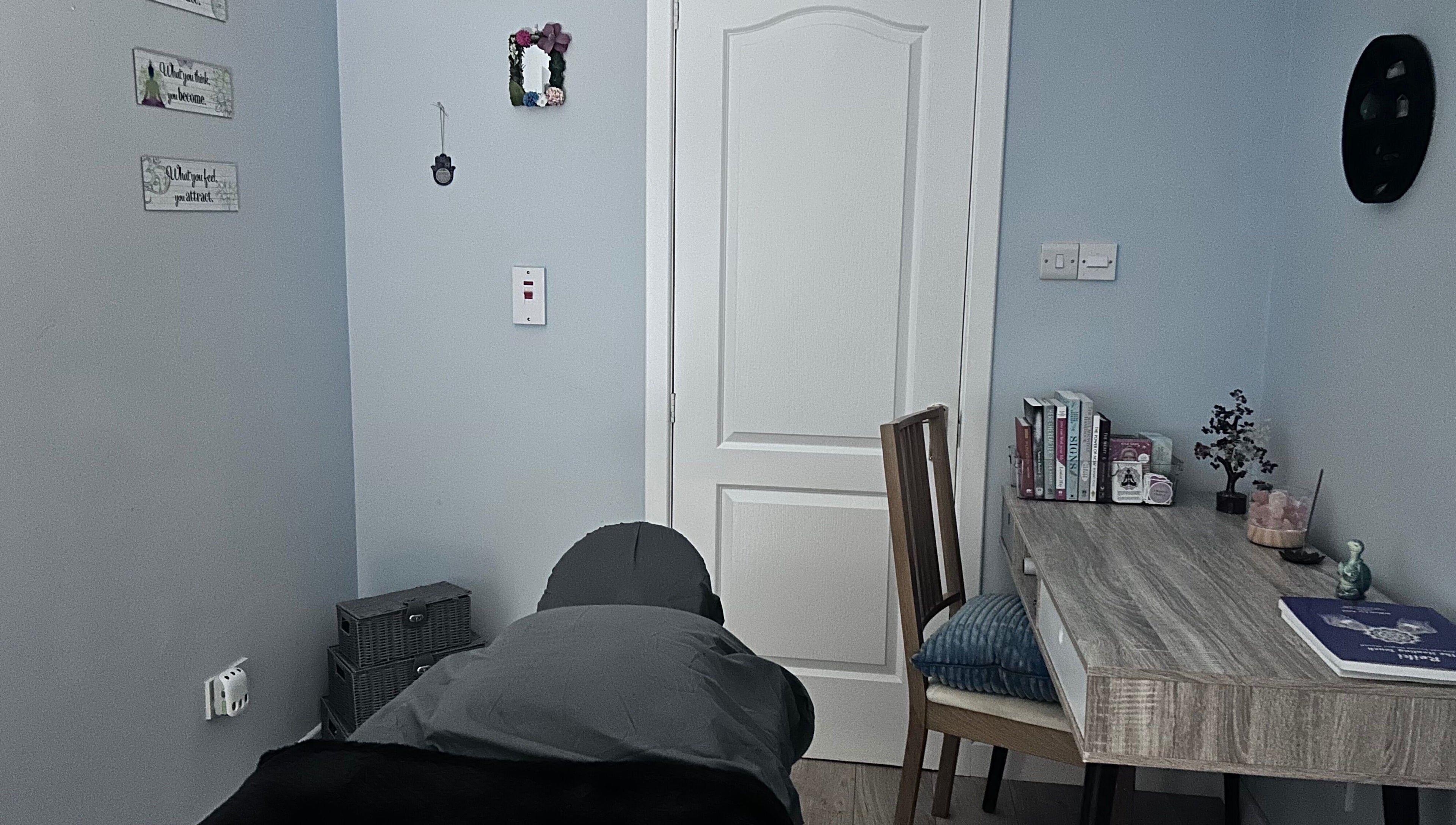 Calming therapy room at Soulely Holistics, Glasgow, Scotland, GB with massage table and cozy decor.