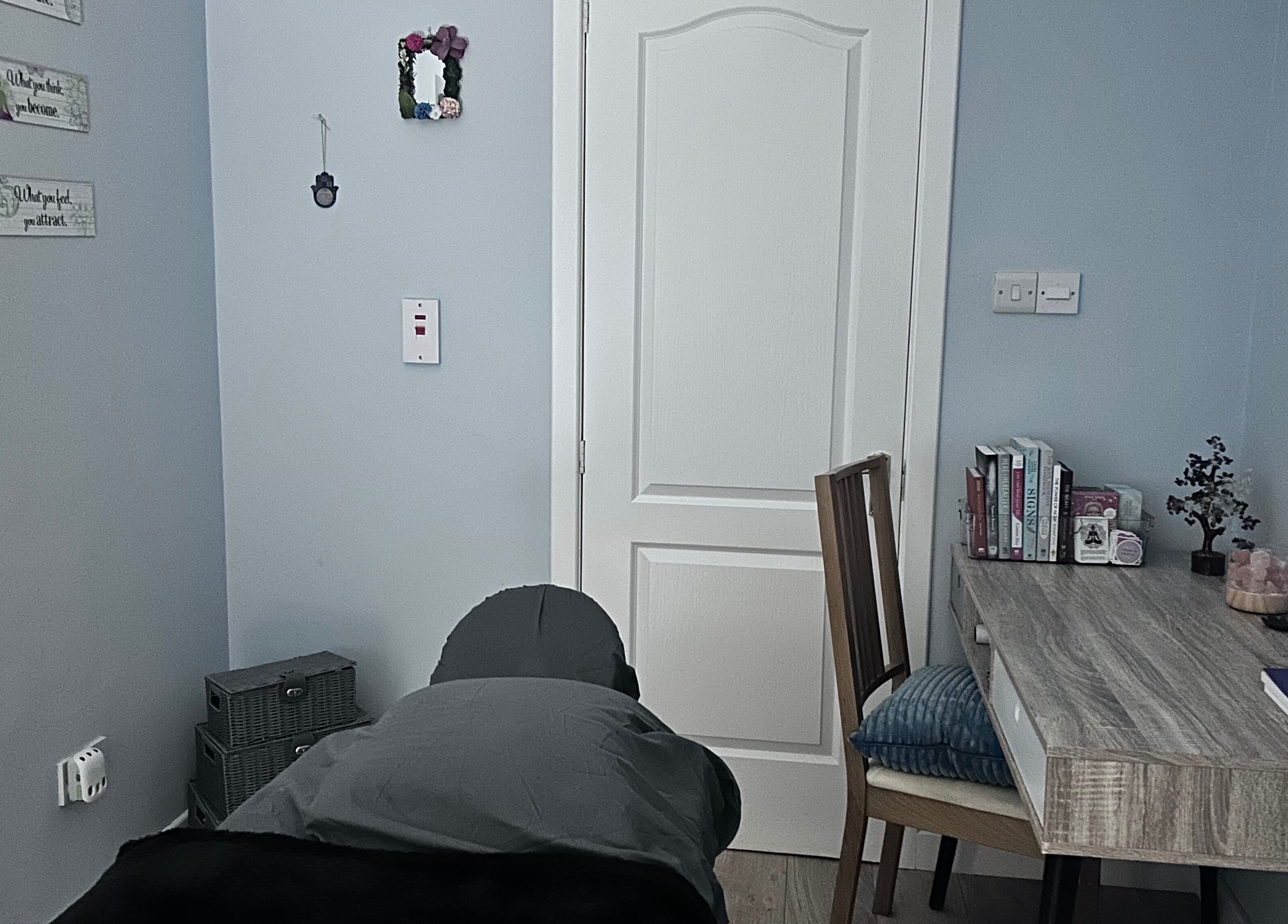 Calming therapy room at Soulely Holistics, Glasgow, Scotland, GB with massage table and cozy decor.