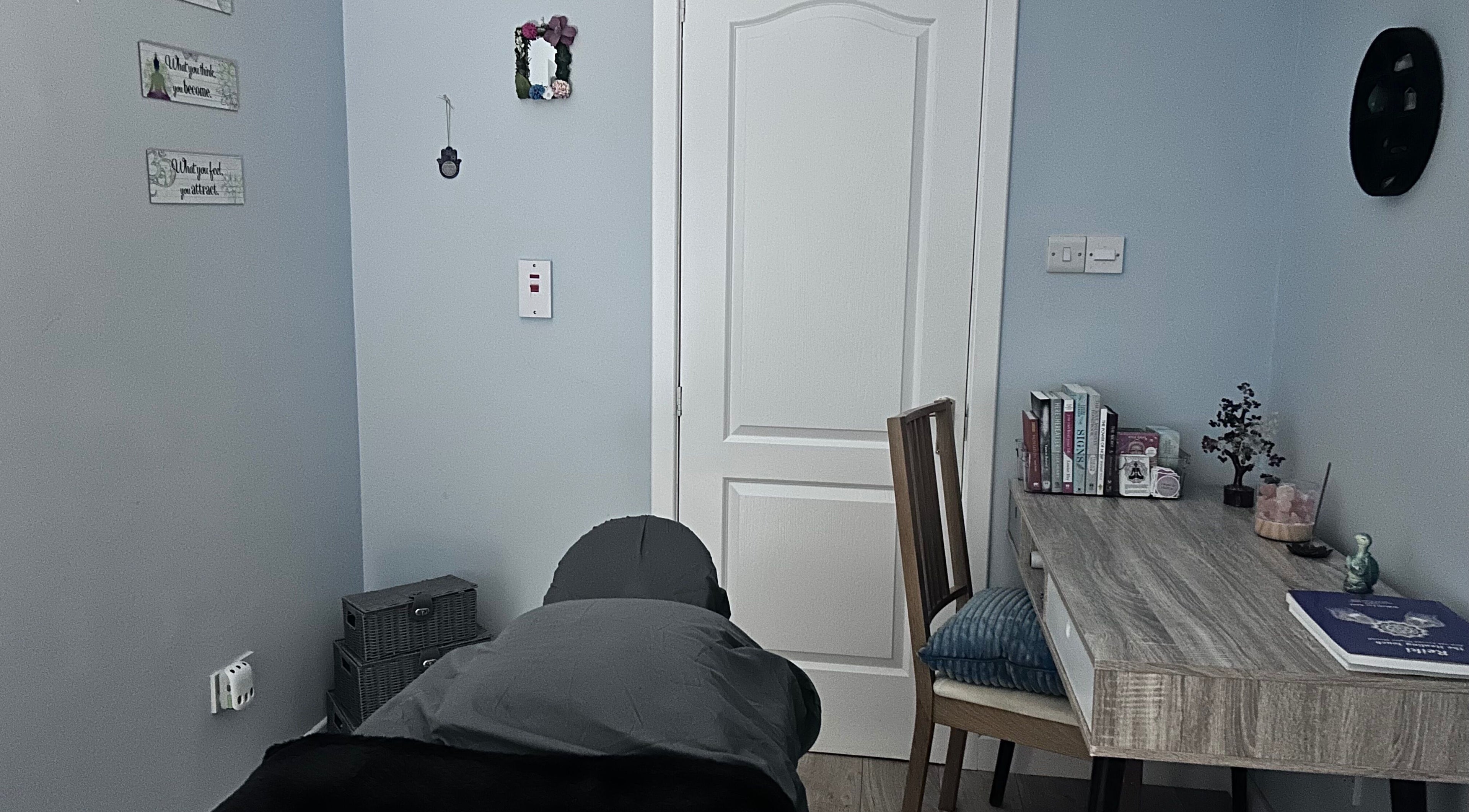 Calming therapy room at Soulely Holistics, Glasgow, Scotland, GB with massage table and cozy decor.