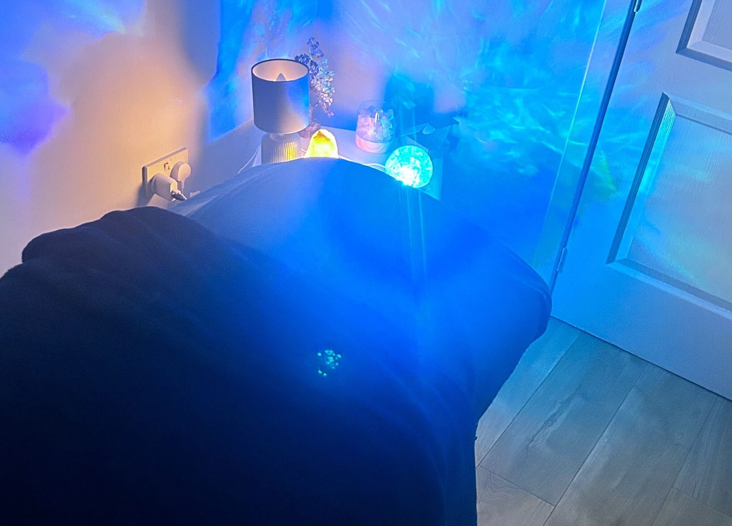 Relaxing therapy room with calming blue lights at Soulely Holistics, Glasgow, Scotland, GB.