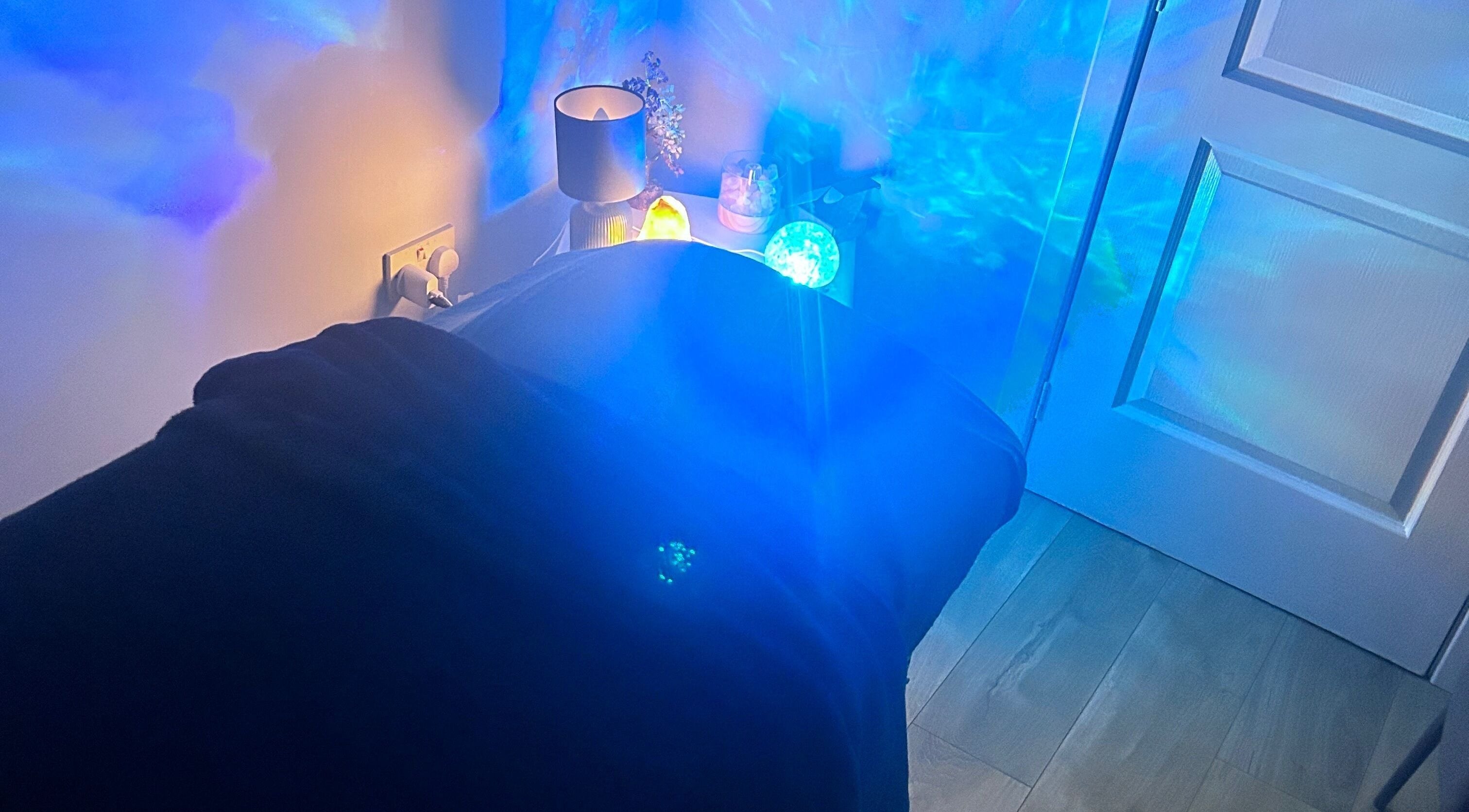 Relaxing therapy room with calming blue lights at Soulely Holistics, Glasgow, Scotland, GB.