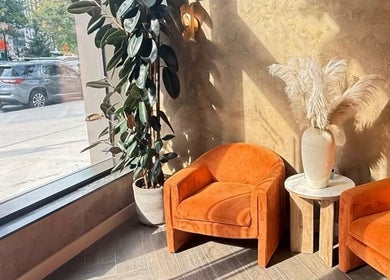 Elegant seating and decor at Chic Luxury hair studio, Valley Stream, New York, US, with natural light.