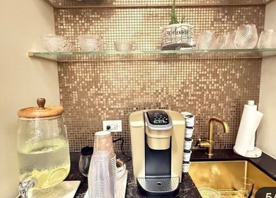 Chic Luxury hair studio's elegant coffee station with gold accents in Valley Stream, New York, US.