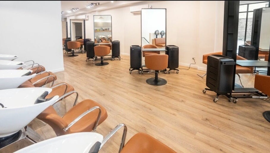 Modern salon seating at Chic Luxury Hair Studio, New York, New York, US shows elegant and spacious design.