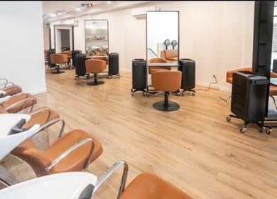 Modern salon seating at Chic Luxury Hair Studio, New York, New York, US shows elegant and spacious design.