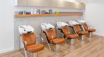 Modern wash stations at Chic luxury hair studio, New York, New York, US, showcasing sleek and stylish design.