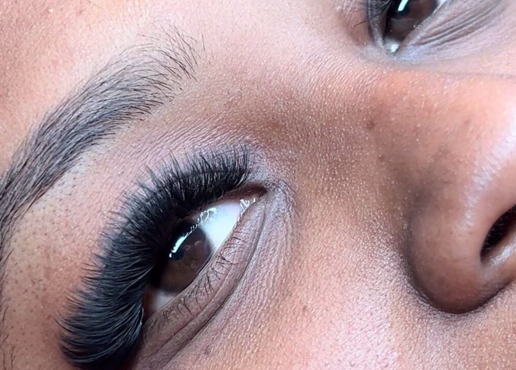 Close-up of eyelash extensions at Poised Beauty, Sint Maarten, SX showcasing lush lashes.