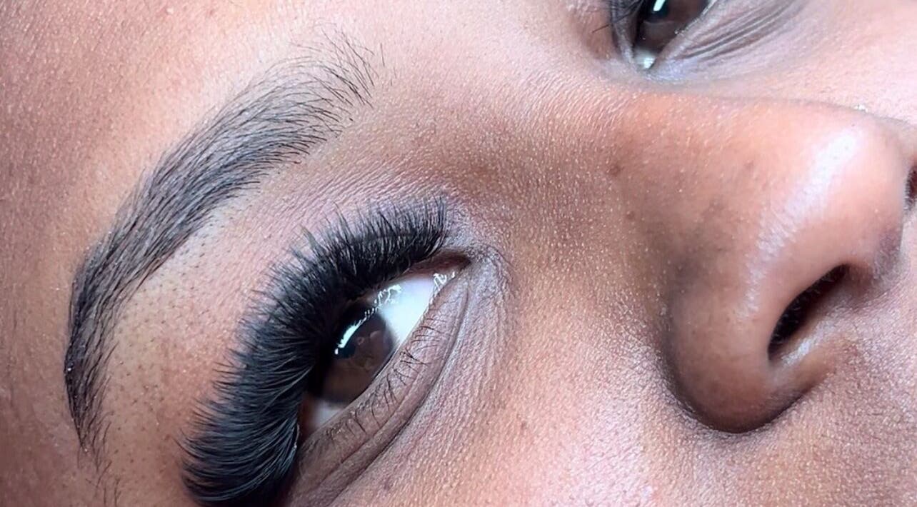 Close-up of eyelash extensions at Poised Beauty, Sint Maarten, SX showcasing lush lashes.
