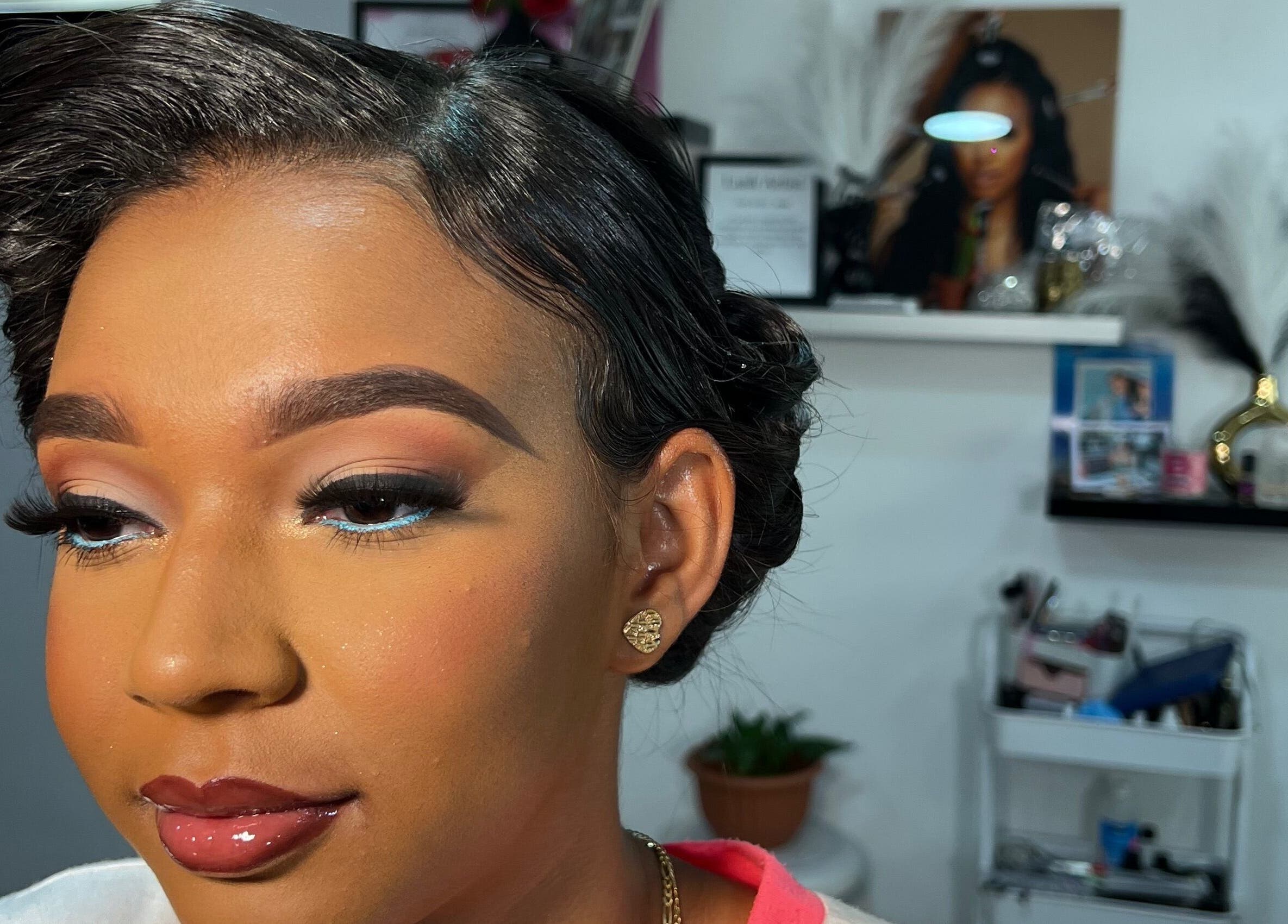 Elegant makeup at Poised Beauty in Sint Maarten, SX showcasing flawless eyebrows and shimmering lips.